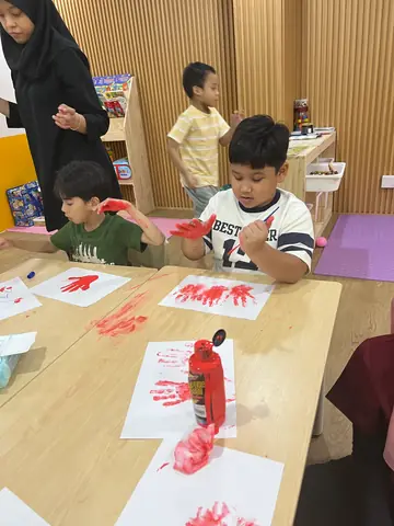 Learners exploring colour through a hands-on art activity