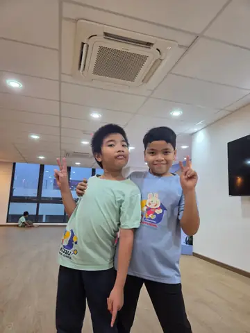 Two KSS learners sharing a positive peer moment