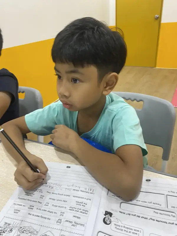 A learner completing focused writing work